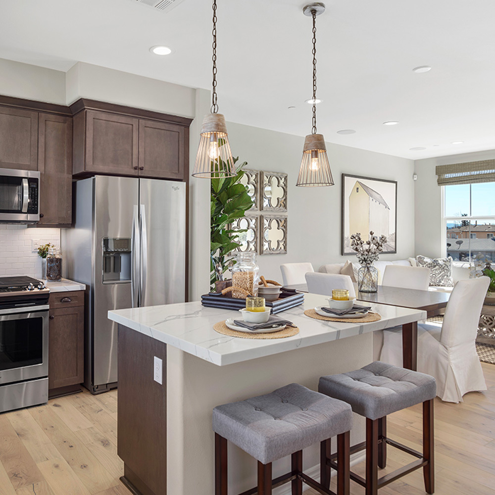 Kitchen with island, dining, and living space Brandywine Homes